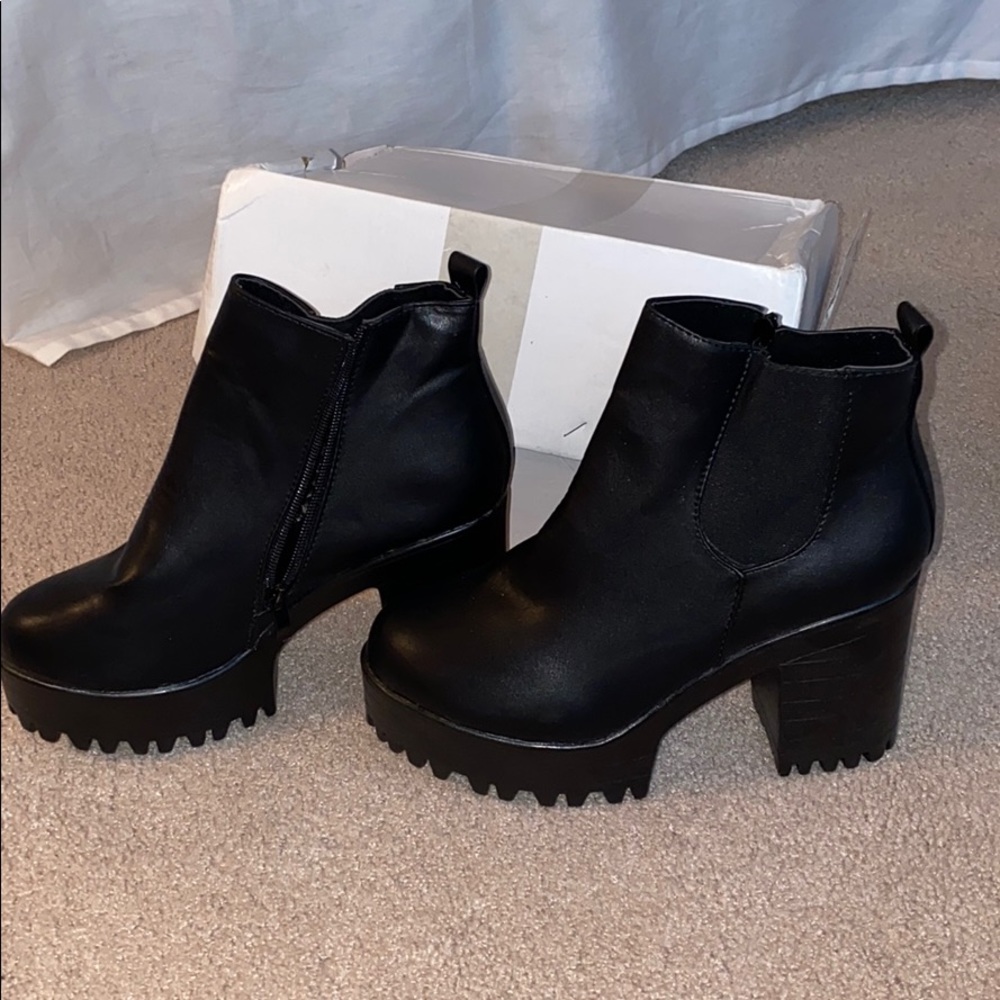 Black platform booties. NEVER WORN, original box.